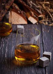 Glass of whiskey with stones