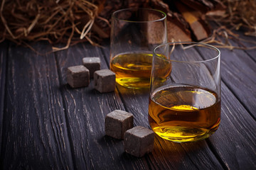 Glass of whiskey with stones