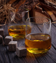 Glass of whiskey with stones