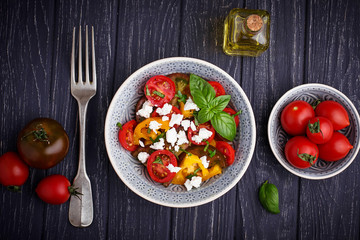 Colorful tomatoes salad with feta cheese