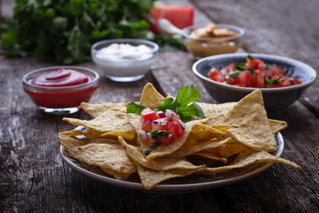 Mexican corn chips nachos with salsa dip