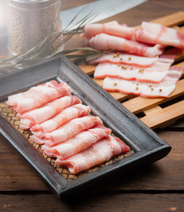 Pork belly sliced on wood