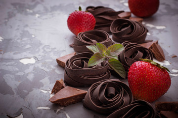 Uncooked chocolate pasta and strawberry