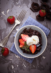 Chocolate pasta with ice cream and strawberry