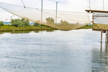 fishing hut in the quiet of brackish lagoon