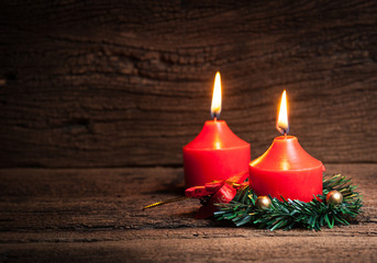 Christmas candles and lights on wood background