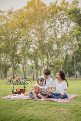 happy asian family in nature ,Beautiful family portrait ,Happy Asian Family In Garden