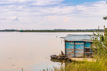 Fototapeta na wymiar fishing hut in the quiet of brackish lagoon