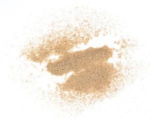 Fototapeta na wymiar closeup of a pile of sand on a white background