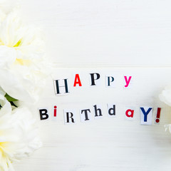 Happy Birthday Letters Cut out from Magazines and White Peonies