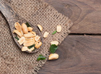 Roasted Peanuts and herb on wood