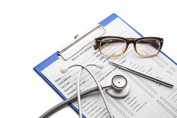 Patient information with pen glasses and stethoscope white backg
