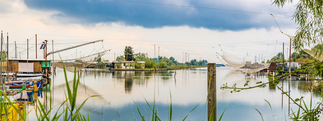 fishing huts in the quiet of brackish lagoon