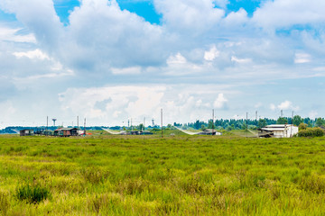 fishing huts in the quiet of brackish lagoon