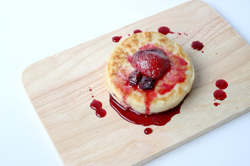 English Crumpets & Berry Topping on wood board isolate on white background