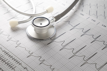 Stethoscope on the ECG. medical symbolic close-up photo
