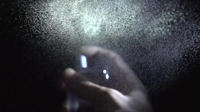 Perfume spraying on camera video with sound