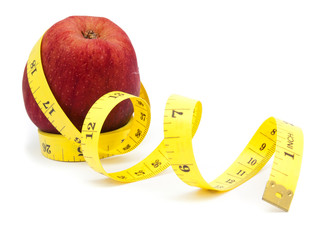 fresh apple with measuring tape isolated