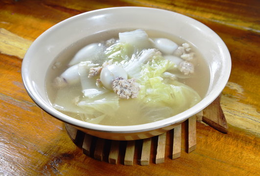 boiled chop pork stuffed squid with Chinese cabbage hot soup in bowl