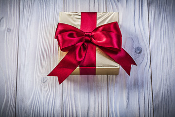 Gift box on wooden board holidays concept