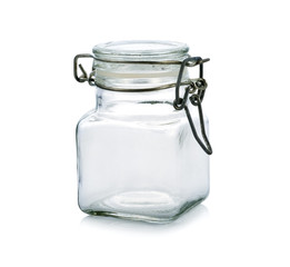 Empty glass jar isolated on a white background