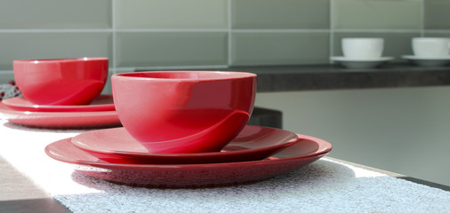 Coffee cups with plates on a table