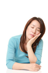 Fototapeta premium middle aged Japanese Woman Sleeping on the Table