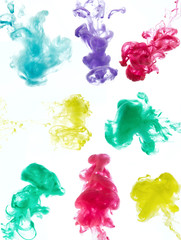 The clouds of colorful ink on the white