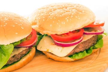 Fresh burger closeup on wooden table