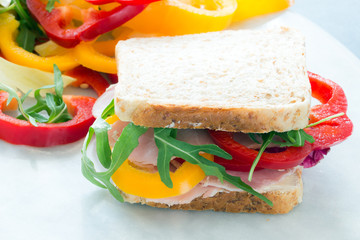 Healthy lunch food sandwich with turkey and ham on a plate