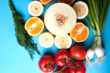 Healthy vegetables and fruits on a blue background