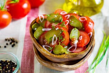 Fresh salad with tomatoes, pickles and onions