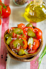 Fresh salad with tomatoes, pickles and onions