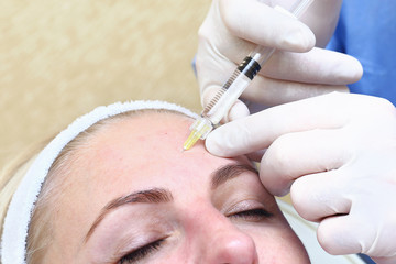 Naklejka premium Anti-age injection therapy. Mimic wrinkles reduction.