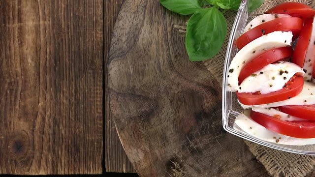 Fresh made Tomato Mozzarella Salad as seamless loopable 4K clip
