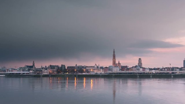 antwerp city skyline time lapse at sunset from day to night pan