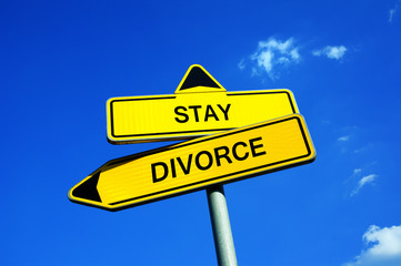 Fototapeta premium Stay or Divorce - Traffic sign with two options - Decision to overcome conflicts, hatred and disputes in marriage between husband and wife or separation. Marriage Counselling / Counseling
