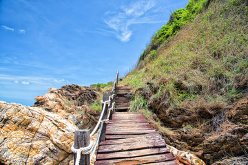 Fototapeta na wymiar Woodern walkway along the beach with beautiful blue sky