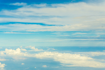 Blue sky and Clouds looking from the Airplane