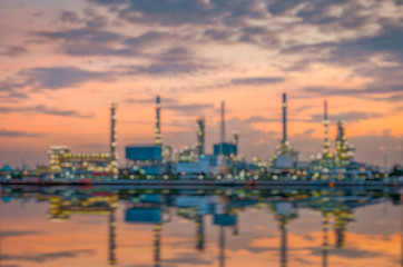 Obraz na płótnie Canvas Oil refinery at sunrise time(Blurred For Background)