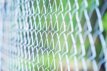 steel wire mesh fence,soft focus.