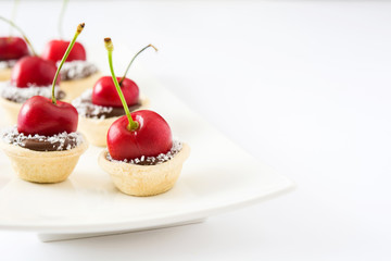Delicious chocolate tartlets isolated on white background
