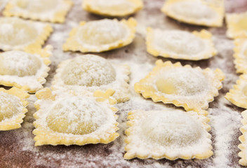 Traditional italian ravioli on cutting board