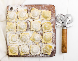 Traditional italian ravioli on cutting board