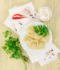 Cooked italian ravioli in white plate
