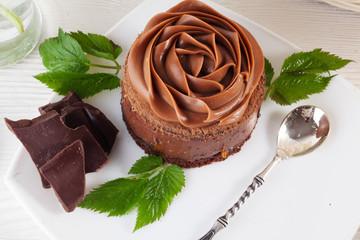 Rose chocolate mousse cake on a beautiful plate cream