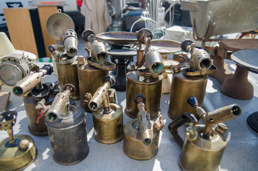 Ancient blowtorches at flea market, France