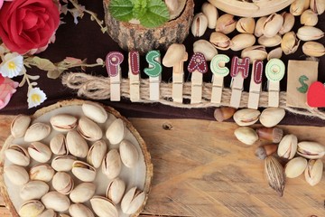 Pistachios is delicious for healthy on wood background.