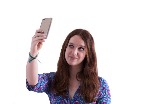 view a young attractive woman take a selfie on the white background