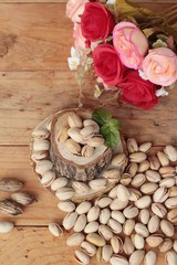 Pistachios is delicious for healthy on wood background.